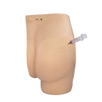 Démonstration de soins aux patients fesses Simulateur d'enseignement d'injection avec lumières d'avertissement