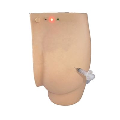 Démonstration de soins aux patients fesses Simulateur d'enseignement d'injection avec lumières d'avertissement